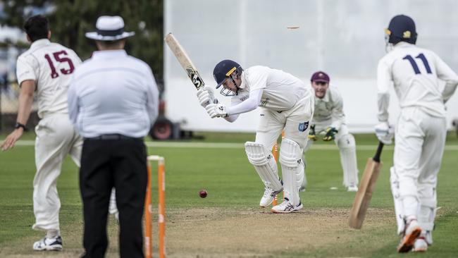 South Hobart-Sandy Bay’s Rowan Shelton is bowled by Clarence's Alex Treanor. Picture: Eddie Safarik