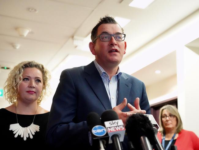 Premier Daniel Andrews (centre) and State Health Minister Jill Hennessy (left) speaks to the media during a press conference in Melbourne, Thursday, July 18, 2018. The state government is planning on improving nurse to patient ratios. (AAP Image/Alex Murray) NO ARCHIVING