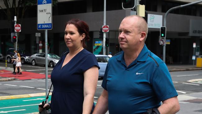 Couple and Queensland Police officers, Bronwyn Smith and Drew Carmichael leave the Supreme Court of Queensland.