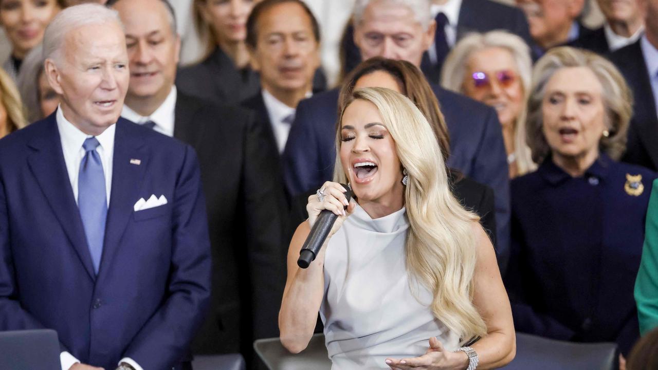 Everyone joined in singing after Carrie Underwood asked the crowd to “help me out.” Picture: AFP