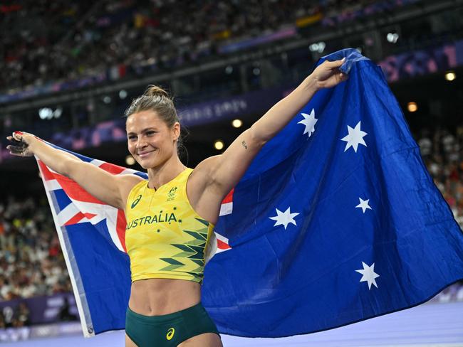 Australia's Nina Kennedy celebrates after winning the women's pole vault final gold medal. Picture: AFP