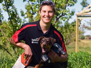 13/10/16 - The 'Best in Nation' award in the WorldSkills student tradie competition, carpenter Ryan Grieger.  Pictured with kelpie Willis on his family's Swan Reach property amongst apricot trees, with part of the gazebo structure that helped him win the awardPhoto Tom Huntley