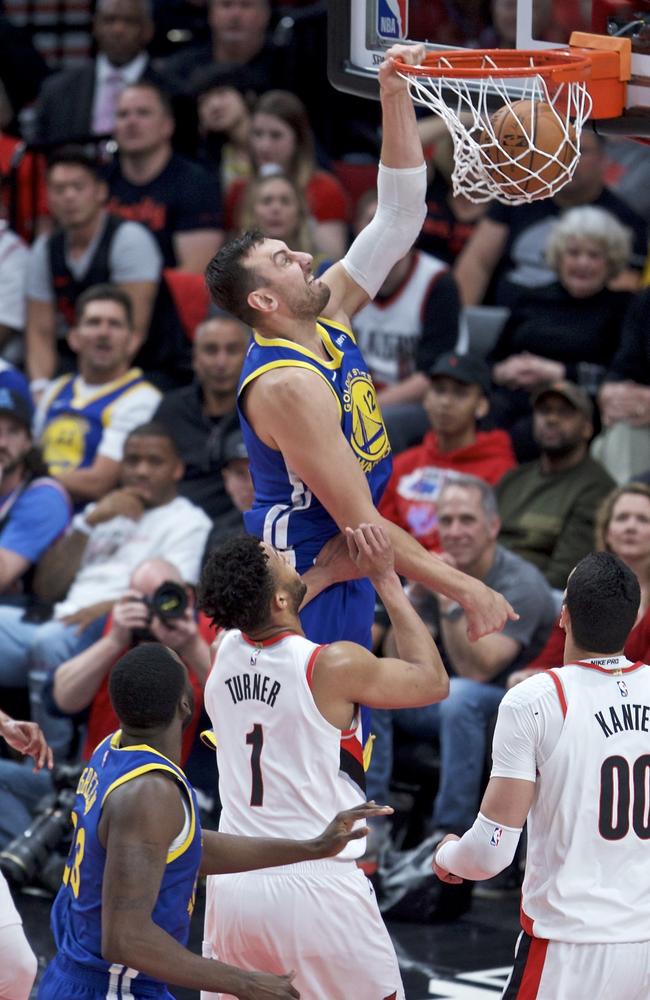 Andrew Bogut drops the hammer on the Blazers. Picture: AP