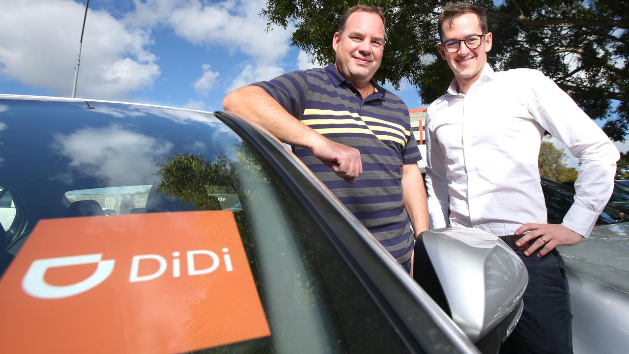 Didi driver Miguel Arroyo from Brisbane with DiDi spokesperson Dan Jordan, who said the company was moving to a flat service fee model. Picture: AAP Image/Steve Pohlner