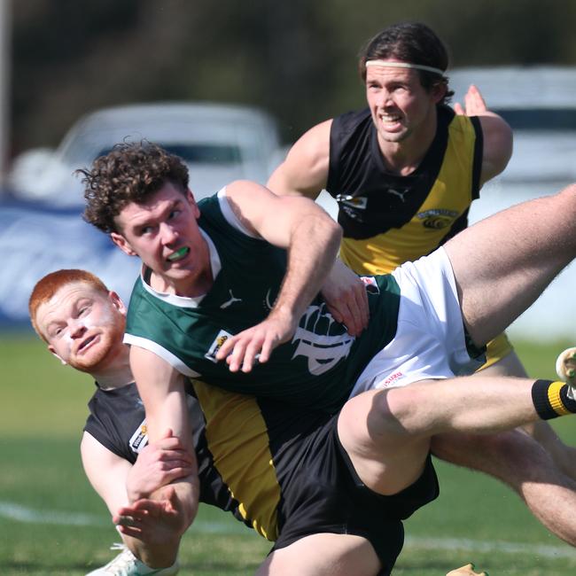 Echuca’s Riley Smith takes on two Rochester opponents, Mitchell Trewhella and Bailey Wileman.