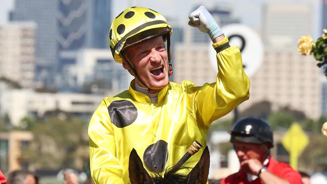 Mark Zahra celebrates as he returns to the mounting yard after winning the Melbourne Cup aboard Without A Fight. Picture: Michael Klein