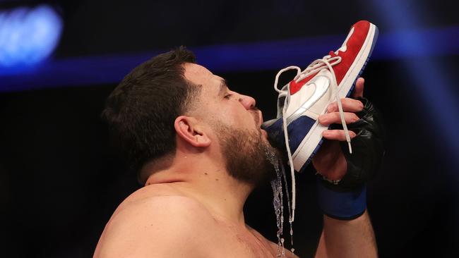 Tai Tuivasa of Australia drinks from his shoe