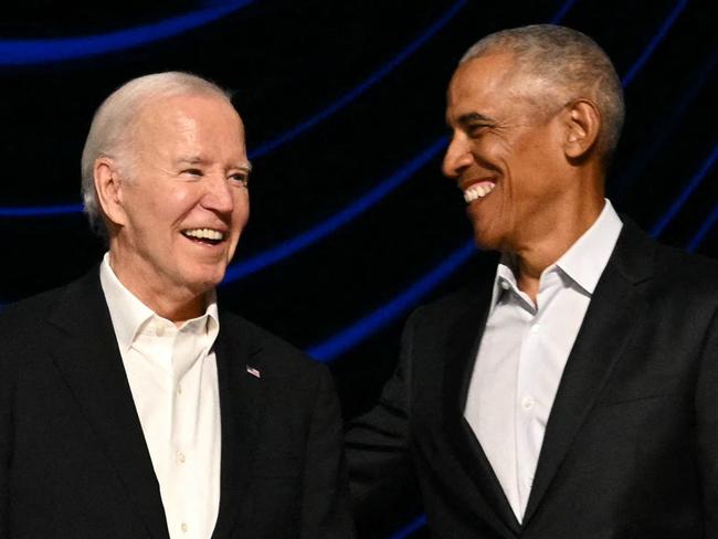 TOPSHOT - US President Joe Biden (L) stands with former US President Barack Obama onstage during a campaign fundraiser at the Peacock Theater in Los Angeles on June 15, 2024. (Photo by Mandel NGAN / AFP)