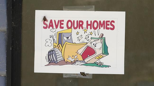 A protest poster on a condemned home at Wantirna caravan park. Picture: David Caird