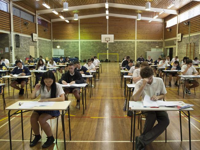 Liverpool Leader - Pictured: Students are given five minutes to read their English examination paper  -  Students at Holsworthy High School are sitting their HSC today.  Holsworthy High is located on Huon Crescent, Holsworthy NSW Australia