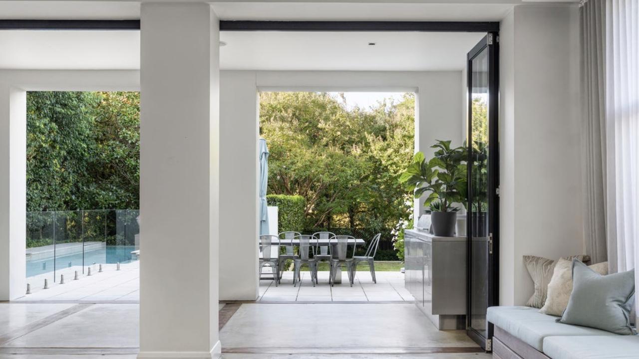 The open-plan living area flows seamlessly to the north-facing garden, creating effortless indoor-outdoor entertaining.
