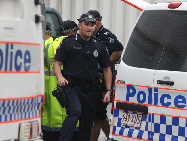 Police comb the scene outside Stocklands Shopping Centre Burleigh Heads where a body was found in a Charity Bin. Picture Glenn Hampson