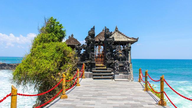 Bali's Tanah Lot temple is at its best early in the morning.