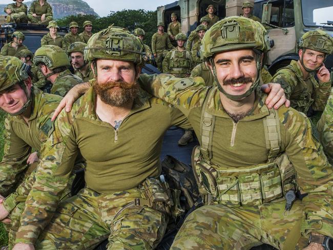 HOLD SEE COURIER MAIL PIC DESK.Sgt Andrew Rimmer and Lt. Harrison Potamianakis (front) with fellow soldiers from 2RAR Amphibious who were involved in the emergency rescues of hundreds of Townsville residents at Idalia as floodwaters rose rapidly after the spillgates were opened at the Ross River Dam. Photo Lachie Millard