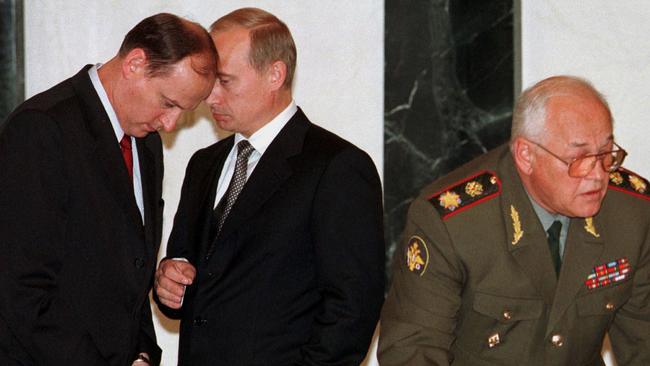 Putin, centre, when he was prime minister, spoke to Patrushev, left, then head of the FSB, in 1999. Picture: Reuters/WSJ