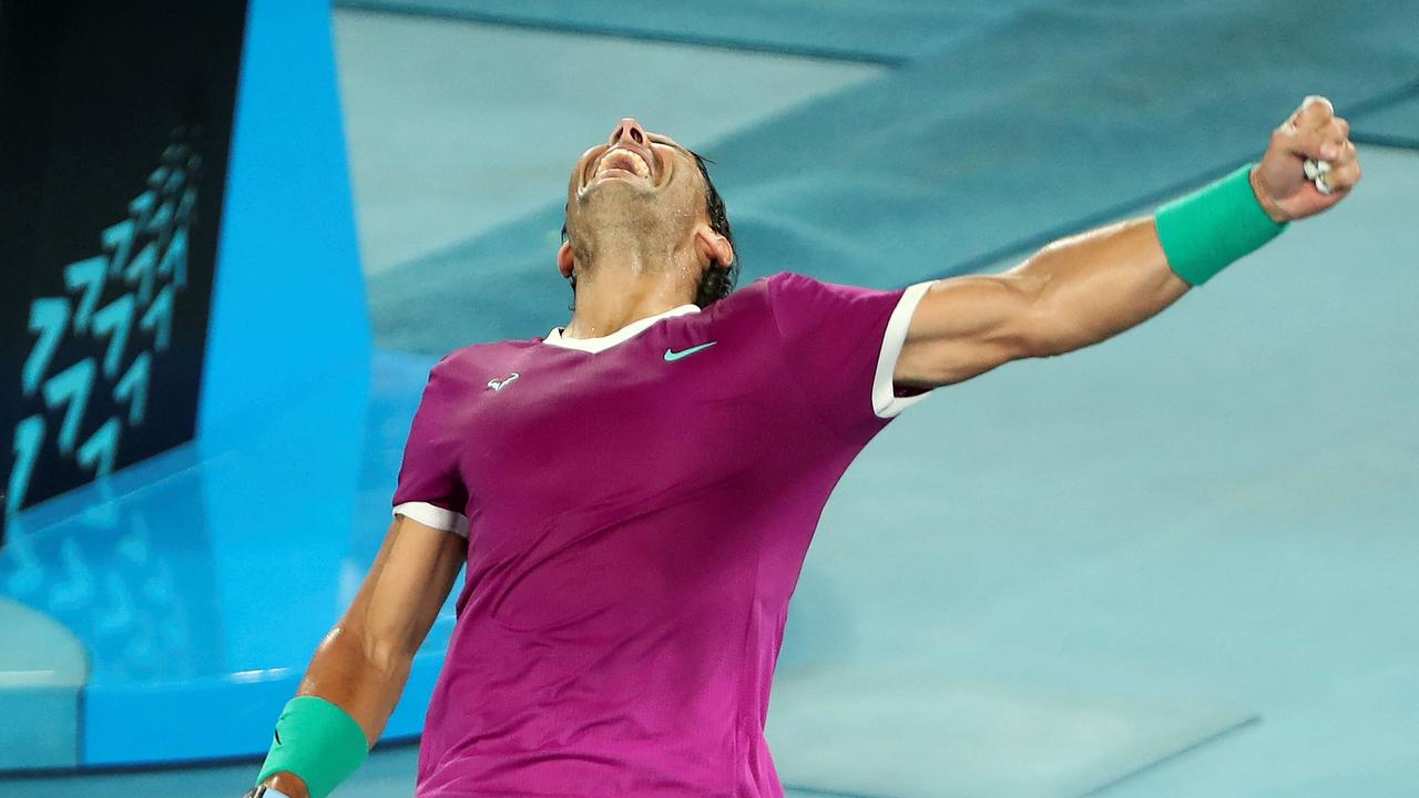 Spain's Rafael Nadal celebrates after winning the men's singles semi-final match against Italy's Matteo Berrettini on day twelve of the Australian Open tennis tournament in Melbourne on January 28, 2022. (Photo by BRANDON MALONE / AFP.