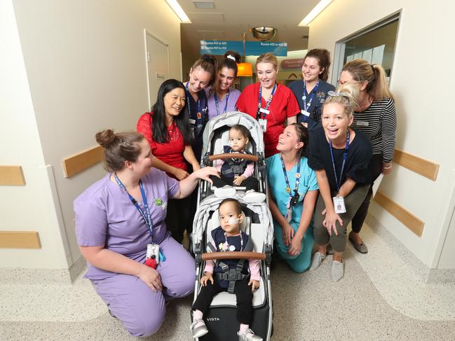 Bhutanese twins Nima and Dawa leave with mum Bhumchu after being discharged from the Royal Children's Hospital. Picture: Alex Coppel