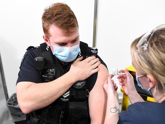 Queensland Police officer Senior Constable Daniel Horne receiving the Pfizer Covid-19 vaccine in Brisbane. Picture: NCA NewsWire / Dan Peled