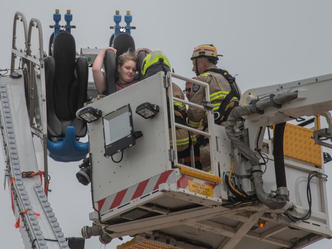 Fire department personnel come to the rescue of kids stuck on a ride in Geelong. Picture: Tony Gough