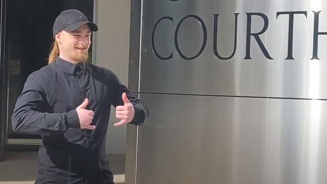 Tye-Allen Gycabi Eldridge laughs and gives a thumbs up as he leaves Southport Court.