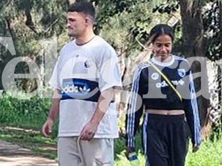 Panthers NRL star Nathan Cleary walks along the Nepean River with Matildas star Mary Fowler. Credit: News Corp