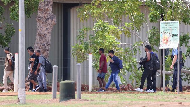 The asylum-seekers being led away by border force officers. Picture: Bardi and Jawi Aboriginal Corporation