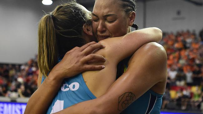 Elizabeth Cambage of the Flyers hugs Jenna O’Hea after the WNBL Grand Final in Townsville in 2020. Picture: Ian Hitchcock