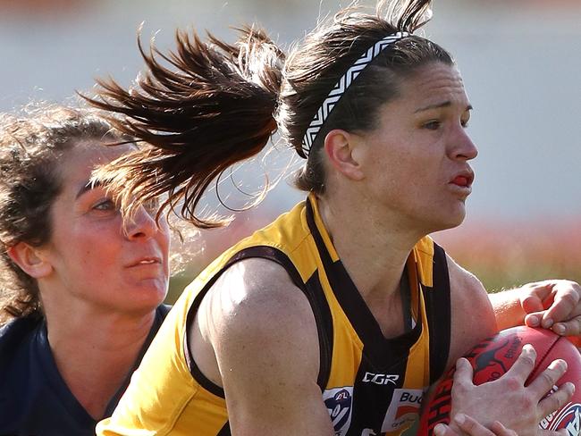 Emma Mackie of the Hawks marks in front of Rebecca Goring of the Cats during the  VFL Womens match between Box Hill and Geelong played at Box Hill City Oval on Saturday 5th August, 2017. Picture: Mark Dadswell