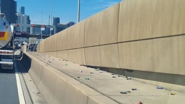 A number of colourful vapes were strewn across the roadside barrier. Picture: Reddit