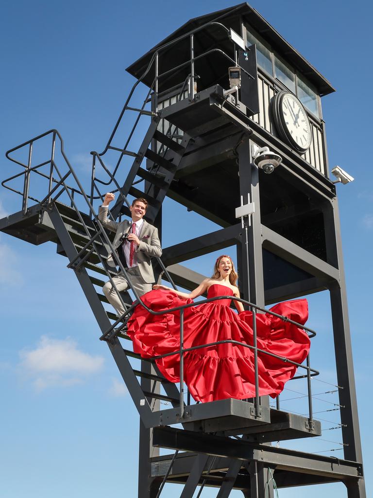 Anna Lynn and Tate Short on the Caulfield Racecourse clock tower. Picture: David Caird