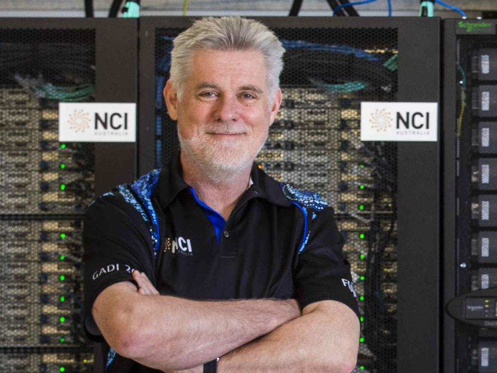 Professor Sean Smith, Director of the National Computational Infrastructure, (l), and Australian National University Associate Professor Megan O'Mara with ANU supercomputer 'Gadi'. Megan uses Gadi for research on COVID-19. Gadi is currently one of the fastest supercomputers in the world. Picture by Sean Davey.