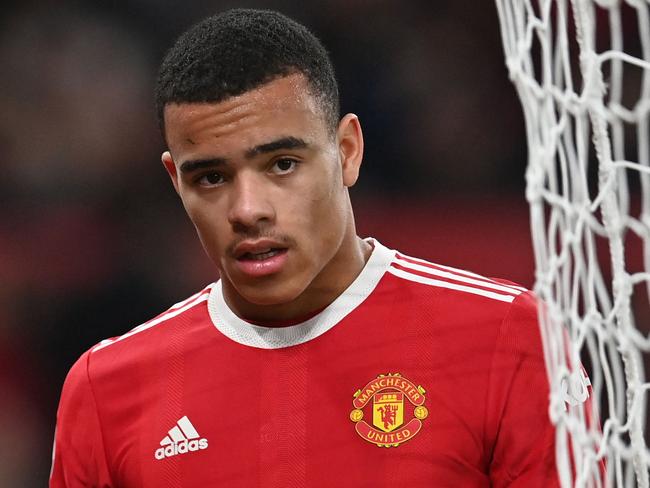 (FILES) In this file photo taken on January 3, 2022 Manchester United's English striker Mason Greenwood is substituted during the English Premier League football match between Manchester United and Wolverhampton Wanderers at Old Trafford in Manchester, north west England. - Manchester United forward Mason Greenwood was released on bail on February 2, 2022 pending further investigation into allegations of the rape and assault of a young woman, police said. Greater Manchester Police said in a statement: "A 20-year-old man arrested (on Sunday January 30 2022) on suspicion of the rape and assault of a woman has been released on bail pending further investigation." (Photo by Paul ELLIS / AFP) / RESTRICTED TO EDITORIAL USE. No use with unauthorized audio, video, data, fixture lists, club/league logos or 'live' services. Online in-match use limited to 120 images. An additional 40 images may be used in extra time. No video emulation. Social media in-match use limited to 120 images. An additional 40 images may be used in extra time. No use in betting publications, games or single club/league/player publications. /