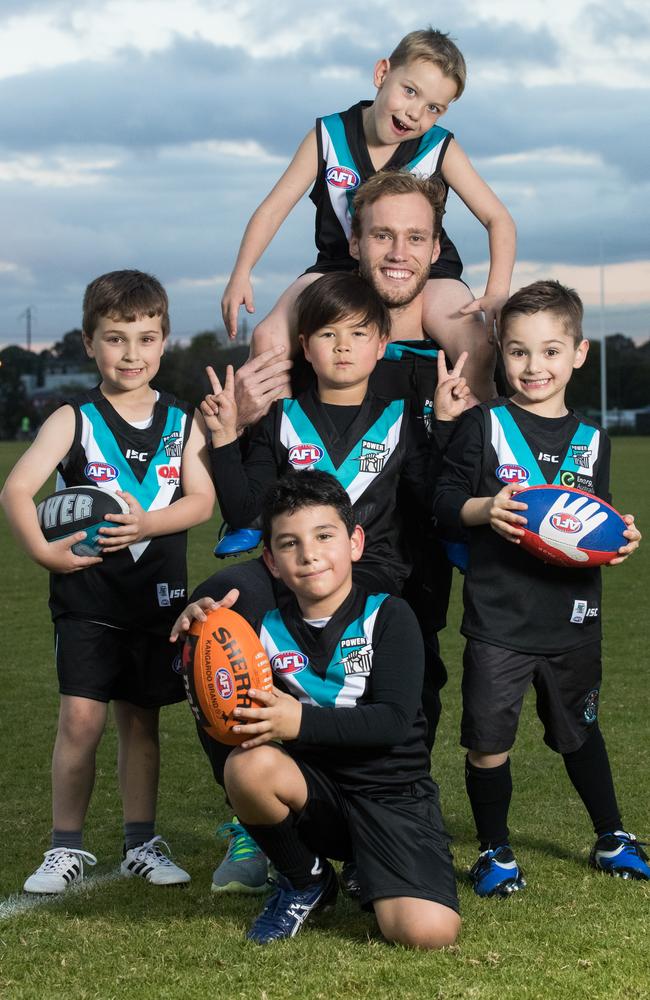 Jack Hombsch with Jarrod, 9, Oscar, 6, Micah, 7, Jack, 5 and George, 8 at Gaza Football Club.