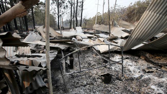 The flattened remains of Les Pitman and Bettina Hartinger-Pitman’s Orara Way home. Picture Nathan Edwards.