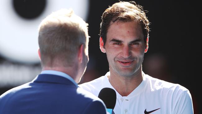 Jim Courier interviews Roger Federer at the Australian Open. Picture: Getty Images