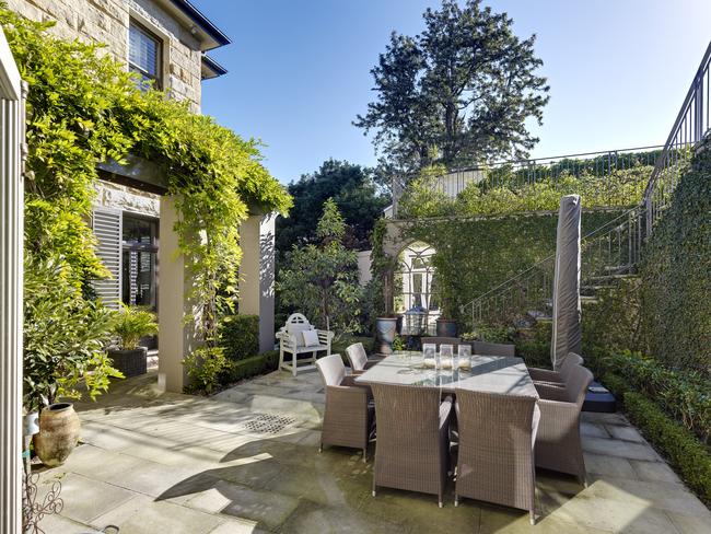 The casual dining room opens onto an ivy covered courtyard perfect for summer dinners.