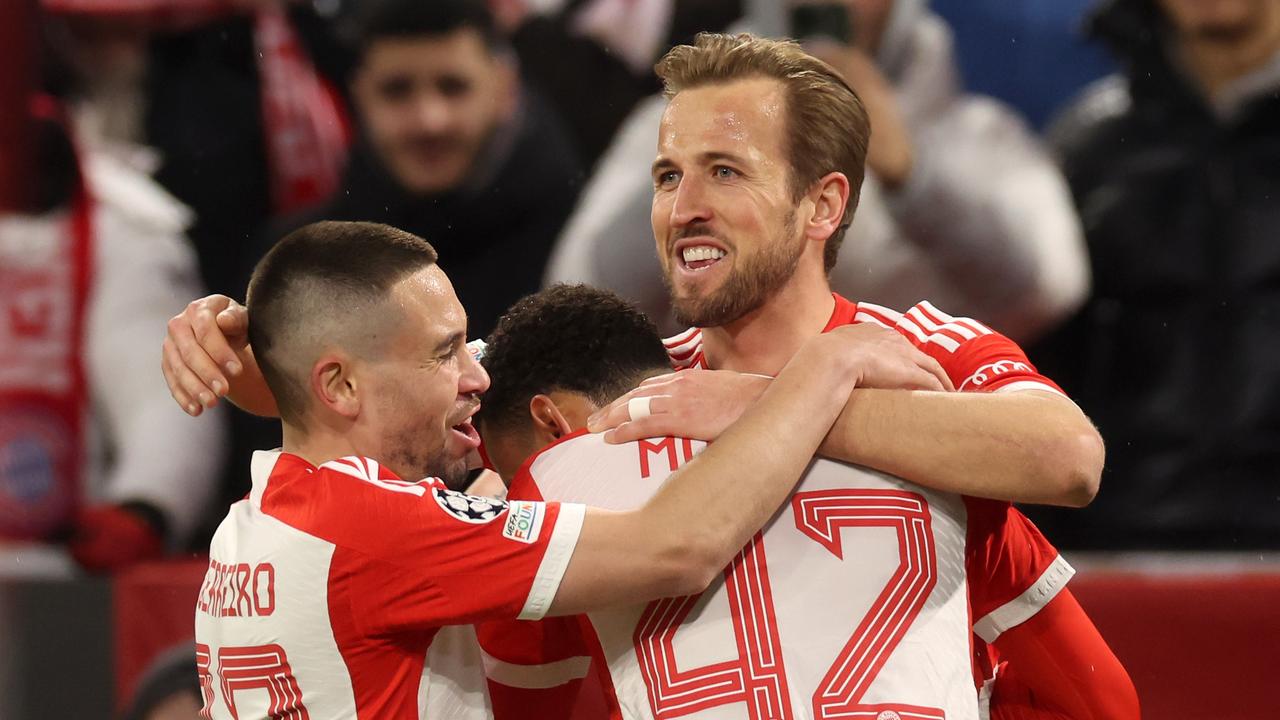 MUNICH, GERMANY – MARCH 05: Harry Kane of Bayern Munich celebrates scoring his team's third goal with teammates Raphael Guerreiro and Jamal Musiala during the UEFA Champions League 2023/24 round of 16 second leg match between FC Bayern MÃ&#131;Â¼nchen and SS Lazio at Allianz Arena on March 05, 2024 in Munich, Germany. (Photo by Alexander Hassenstein/Getty Images)