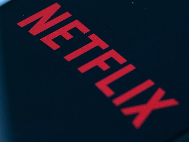 (FILES) In this file photo taken on July 10, 2019 the Netflix logo is seen on a phone in this photo illustration in Washington, DC. - Netflix said jANUARY 21, 2020 it added millions of new subscribers globally over the past quarter as it prepared up for a tougher competitive landscape, but scaled back its outlook for early 2020. The global television streaming giant beat expectations with a profit of $587 million in the fourth quarter of 2019 as revenue rose 31 percent from a year ago to $5.5 billion. (Photo by Alastair Pike / AFP)