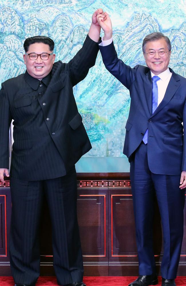 North Korean leader Kim Jong Un and South Korean President Moon Jae-in pose for photographs after signing the Panmunjom Declaration for Peace, Prosperity and Unification of the Korean Peninsula. Picture: Korea Summit Press Pool/Getty Images