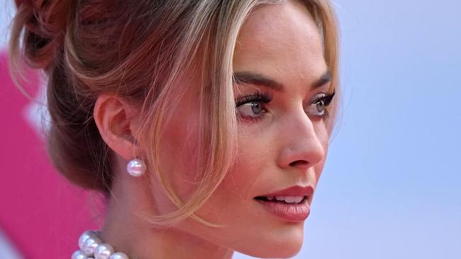 Australian actress Margot Robbie poses on the pink carpet upon arrival for the European premiere of "Barbie" in central London on July 12, 2023. (Photo by JUSTIN TALLIS / AFP)