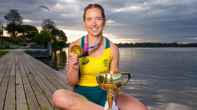 Olympic gold medallist Lucy Stephan with her gold medal and the Lexus Melbourne Cup at Lake Nagambie. Picture: Jay Town