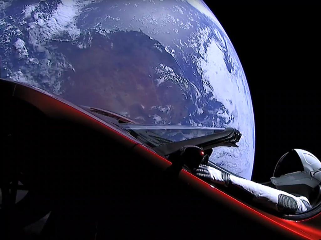 "Starman" sitting in SpaceX CEO Elon Musk's cherry red Tesla roadster after a Falcon Heavy rocket delivered it into orbit around the Earth on February 6, 2018. Picture: AFP