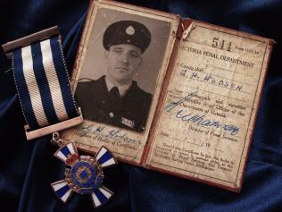 Pentridge Prison guard George Hodson's identity card and medal of valour, which was awarded posthumously.