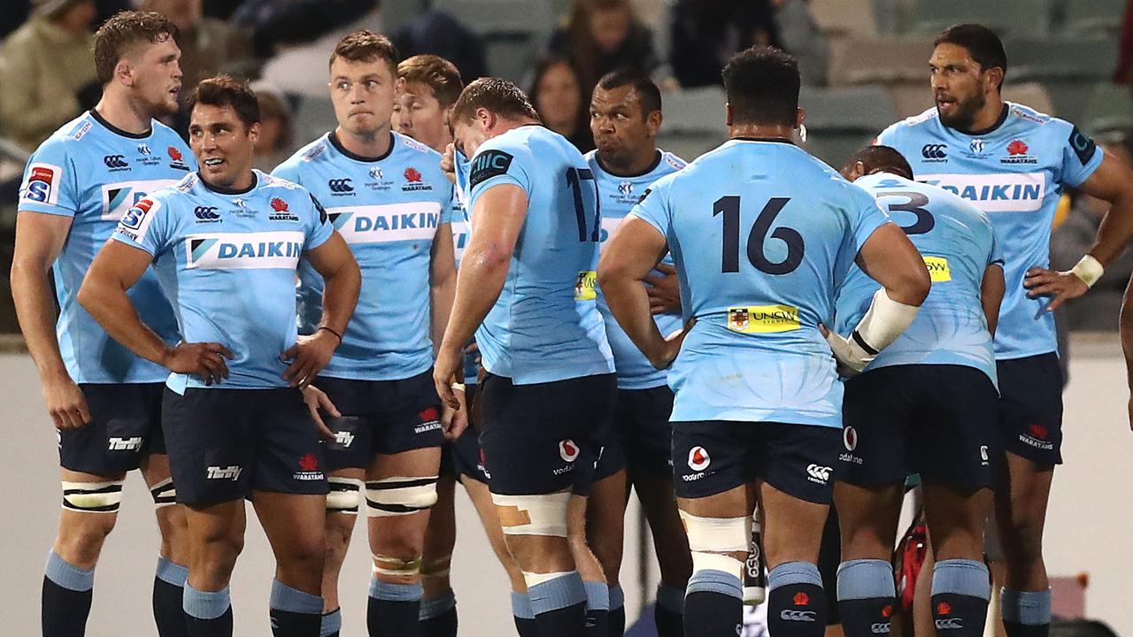 Waratahs players look dejcted after conceding a try at GIO Stadium.