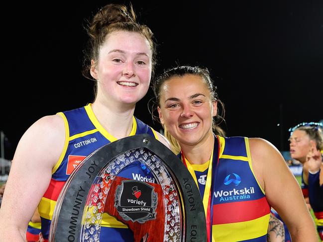 Sarah Allan and Ebony Marinoff of the Crows with the Showdown trophy. Picture: Getty Images