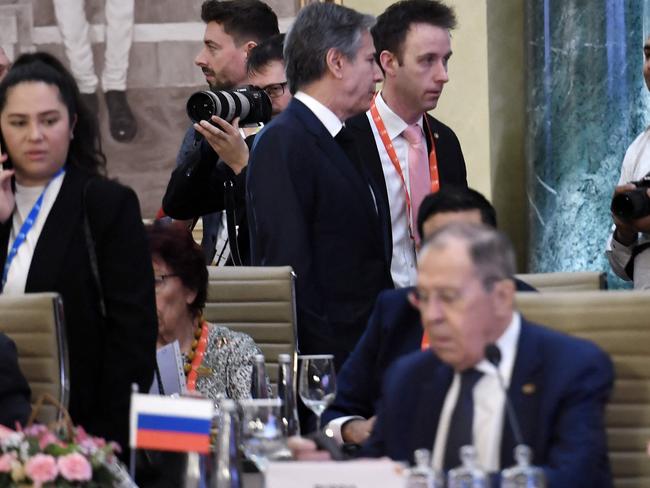 US Secretary of State Antony Blinken (top centre) walks past Russian Foreign Minister Sergei Lavrov (lower) during the G20 foreign ministers' meeting in New Delhi. Picture: AFP