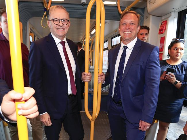 Premier Steven Miles and Prime Minister Anthony Albanese ride on the light rail on the Gold Coast. Picture: Adam Head.