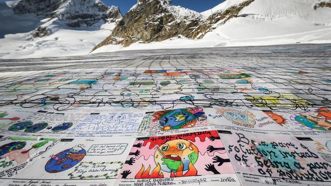 Messages from children from around the world about climate change on the Aletsch Glacier. Picture: AFP