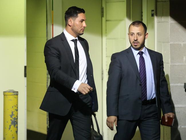 Councillor Salim Mehajer and Councillor Hicham Zraika (right) leave a meeting of Auburn City Council to discuss a motion to ask Salim Mehajer to resign. Picture Craig Greenhill