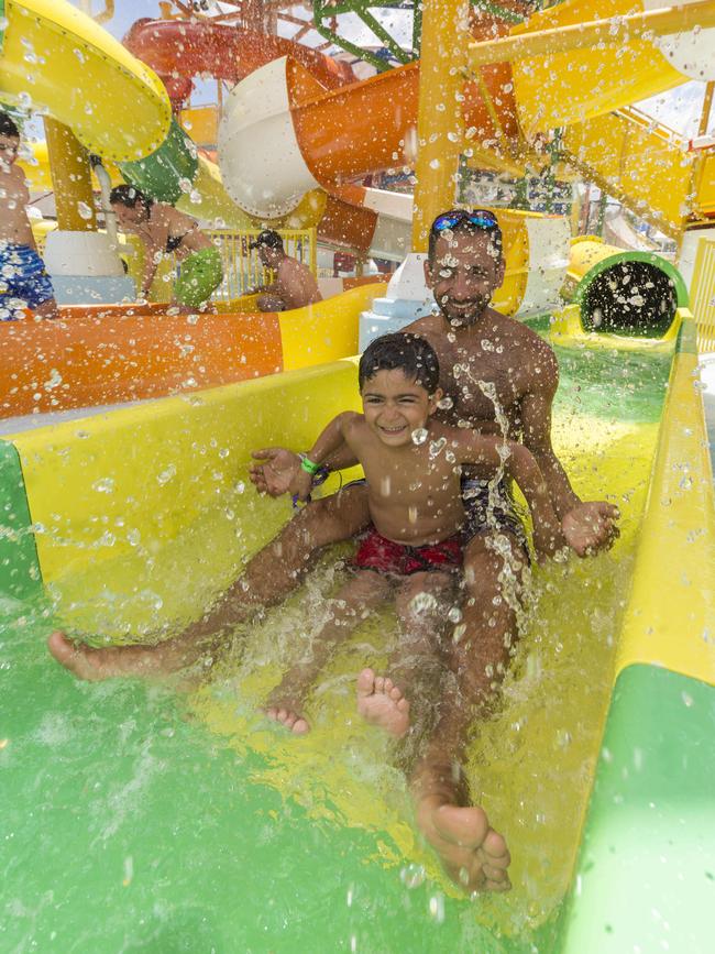 Mustafa Azary and Ali Azary, 6, getting soaked. Picture: Matthew Vasilescu